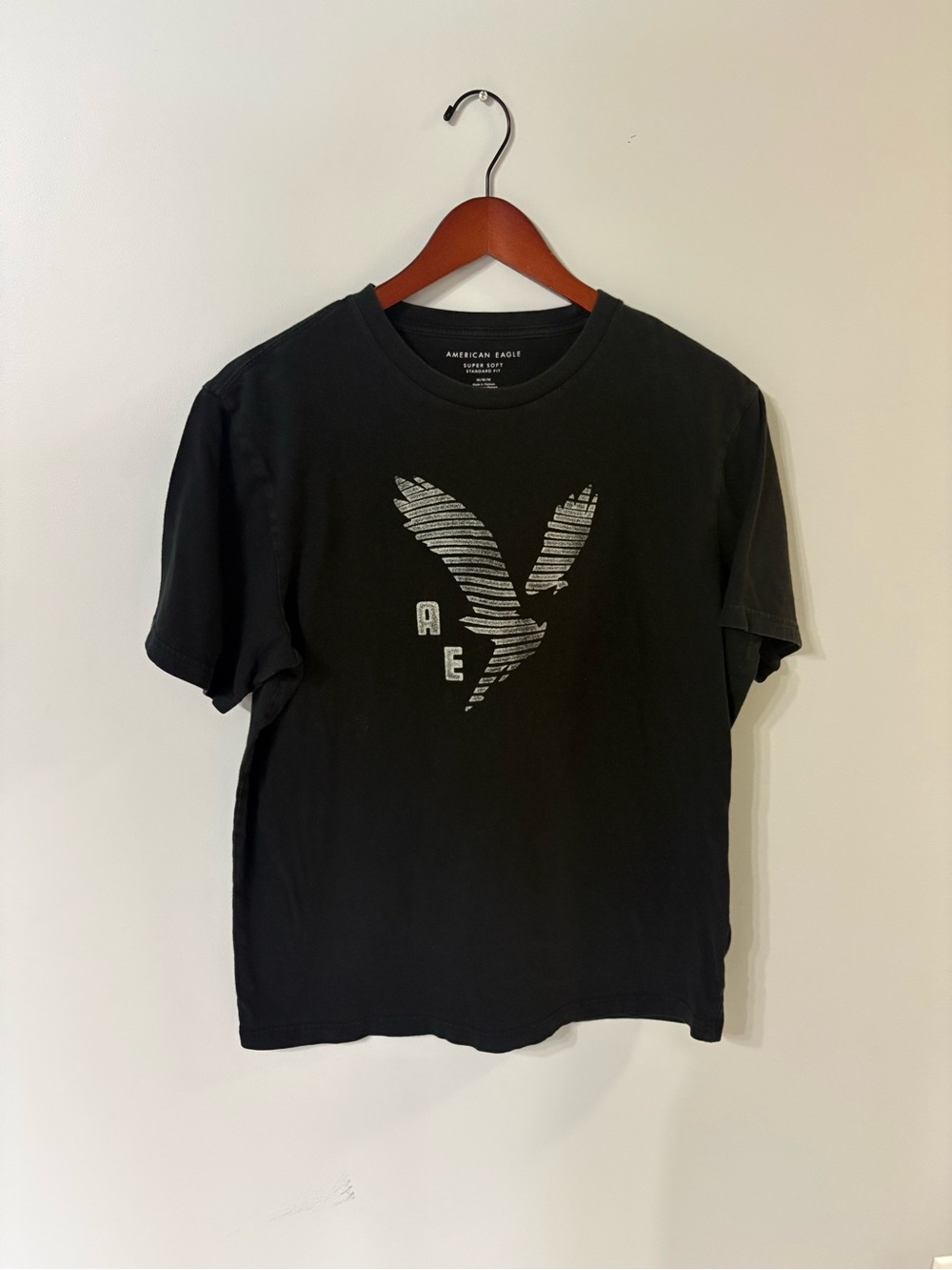 American Eagle Outfitters Black Tee with Striped Eagle Logo